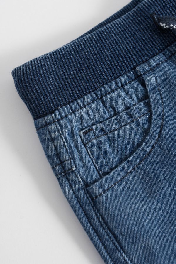 Spodnie jeansowe długie w kolorze niebieskim 2148106