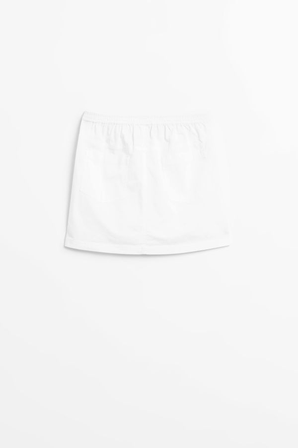 Spódnica tkaninowa trapezowa w kolorze białym z ozdobną taśmą 2149272
