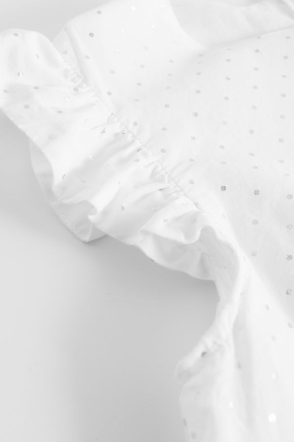 Bluzka bez rękawów z falbanami w kolorze białym 2150586