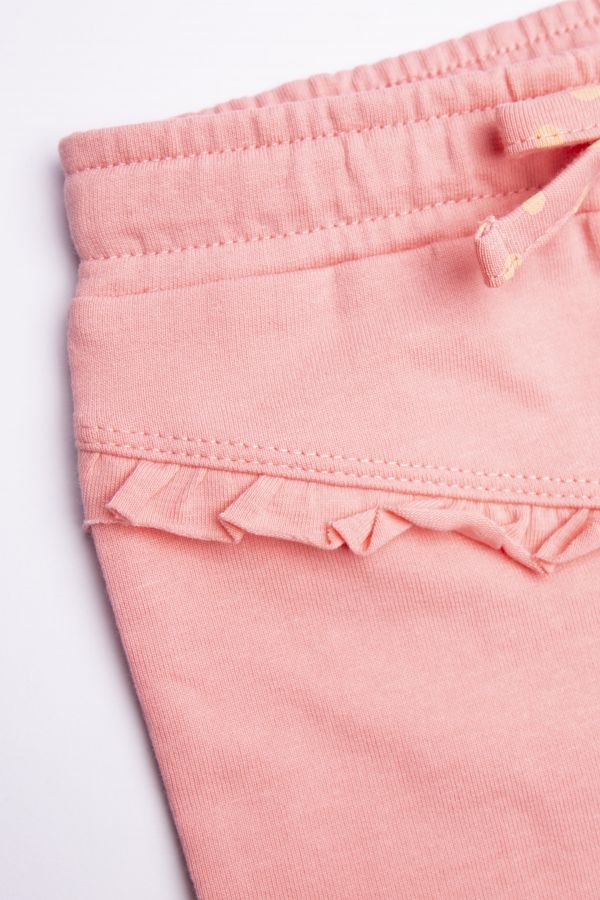 Spodnie dzianinowe w kolorze różowym z ozdobnymi falbankami 2155809
