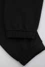 Spodnie dresowe czarne z nadrukiem na nogawce o fasonie SLIM 2222441