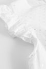 Bluzka bez rękawów z falbanami w kolorze białym 2150586